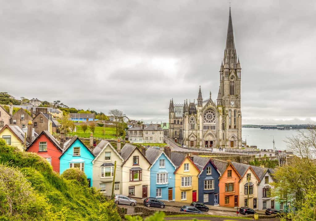 colorful buildings by a cathedral