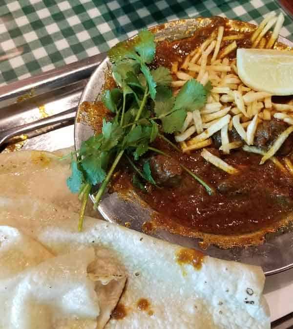 indian food in a metal bowl