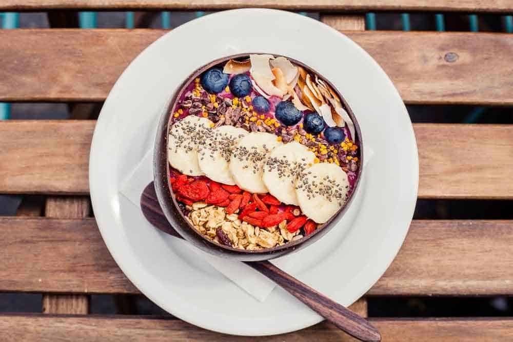 purple smoothie bowl with fruit