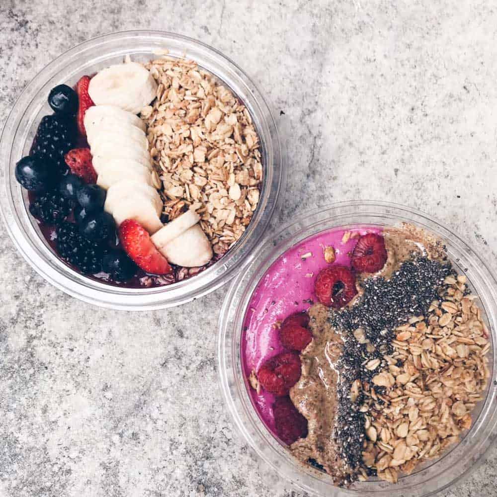 two acai bowls on a table