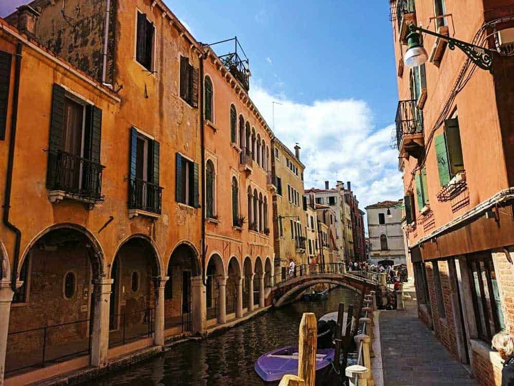 venice canal with bridges and gondolas