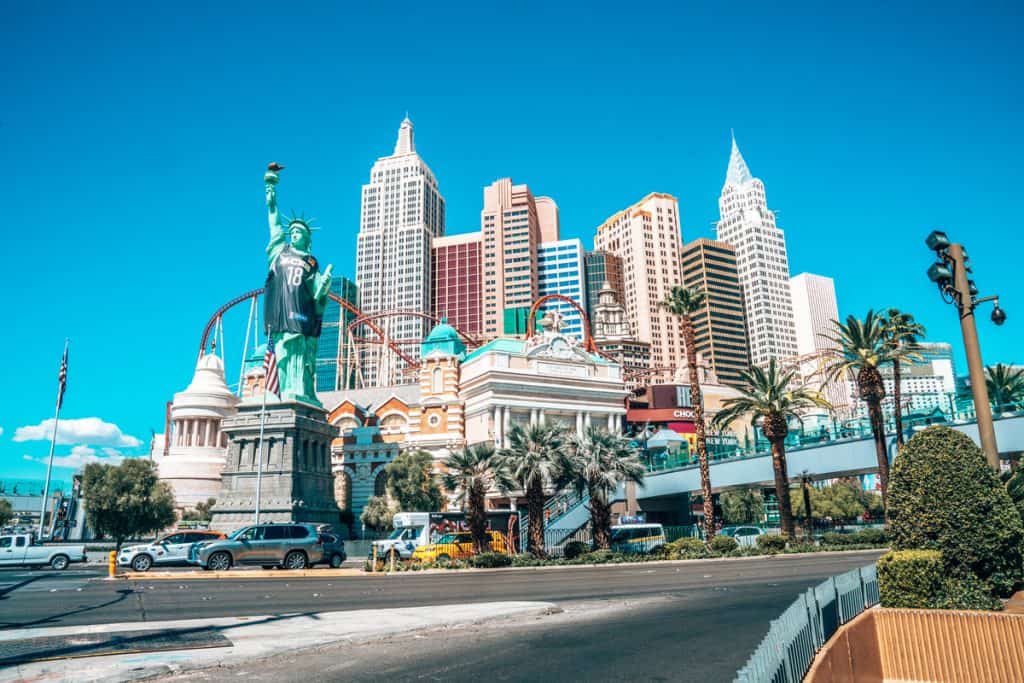 view of the New York New York hotel in Las Vegas from across the street 
