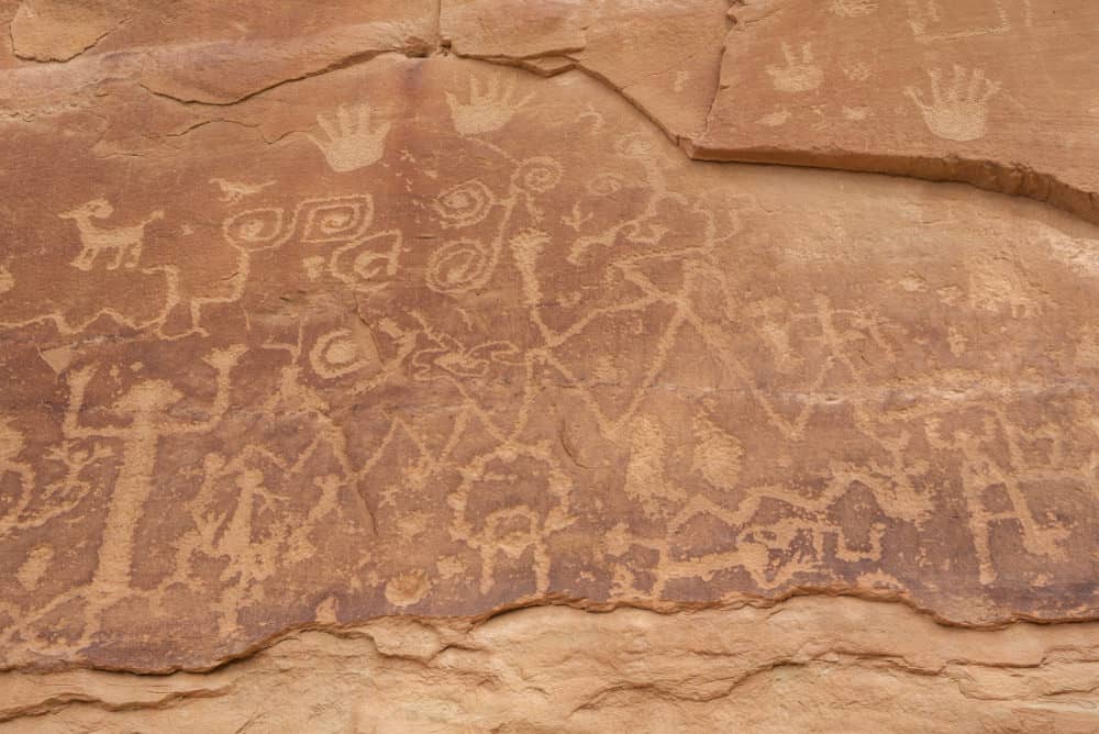 Petroglyphs carved into the side of a rock 
