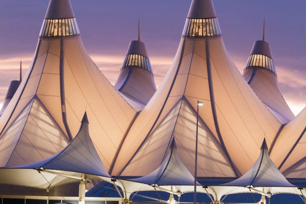 An airport under a purple sky.