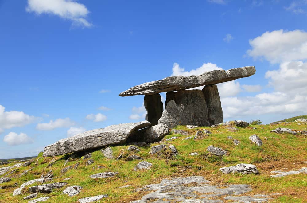 Large stone formation at the top of a small hill 