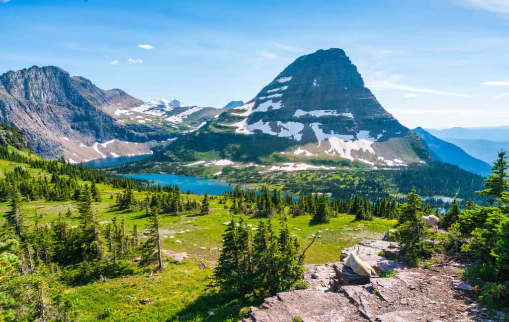 Blue lake and snowy mountains in Glacier National Park.