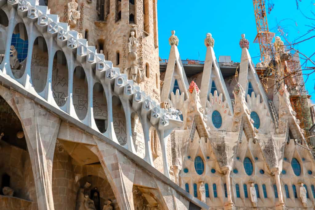 A close up view of a building whose architecture matches Gaudi's style. 