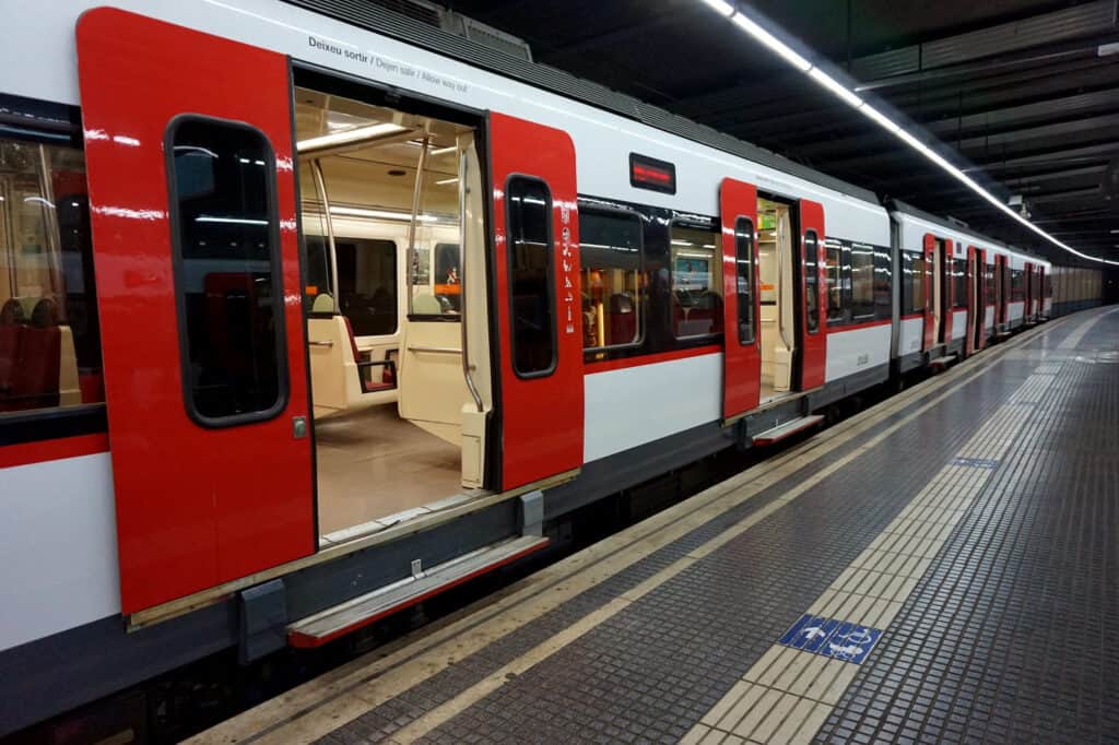 An underground metro train with the doors open.