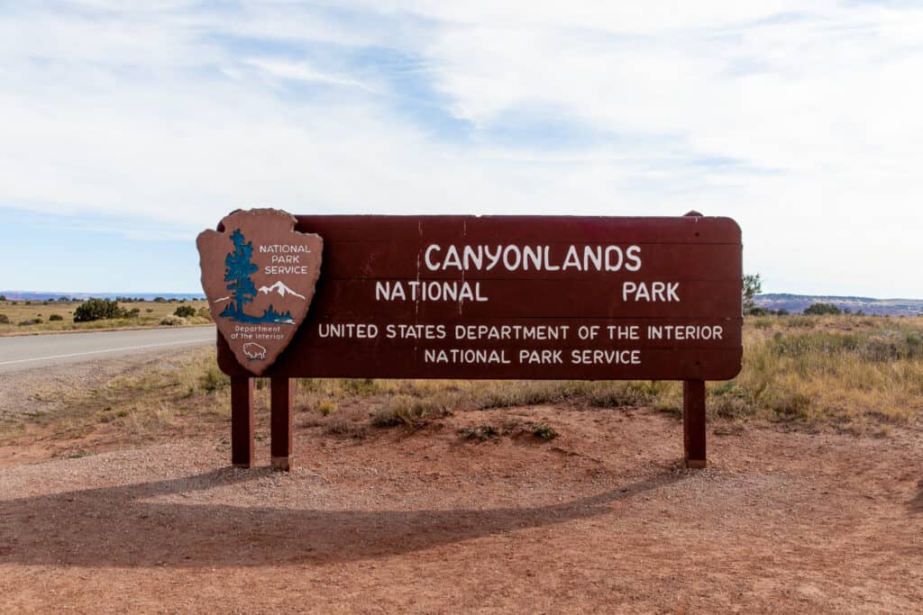 Wooden sign that reads Canyonlands national park United States department of the interior national park service